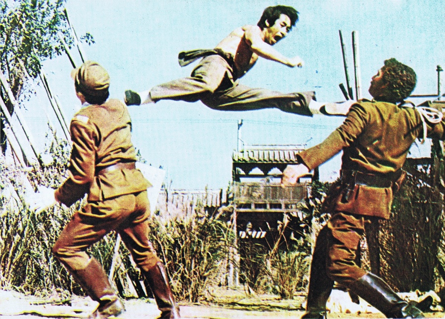 Grandmaster Kim Jin Pal performing a split kick